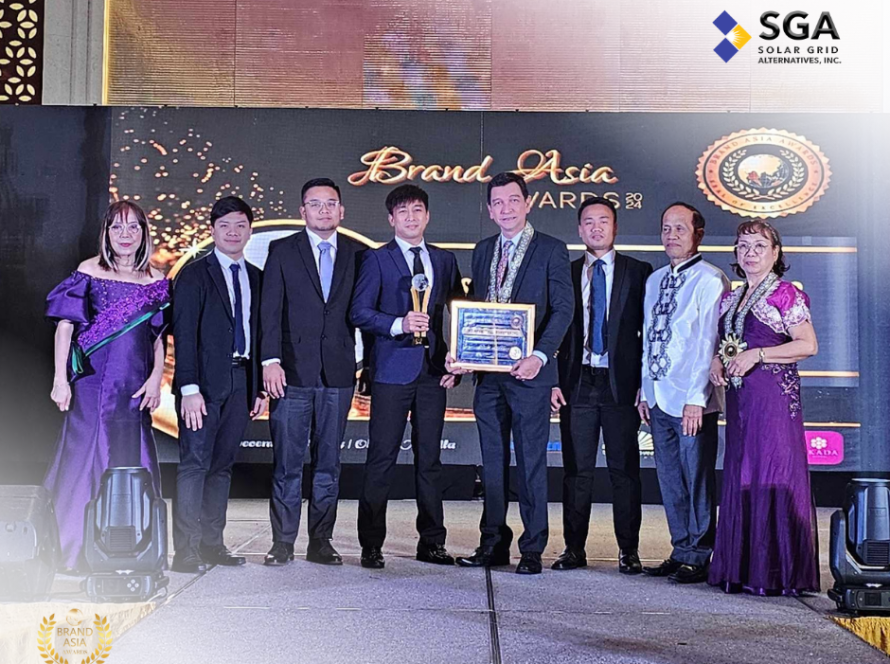 Team members of SGA Solar Grid Alternatives, Inc. posing with the Top Quality Brand award, celebrating their achievement at the Brand Asia Awards 2024.