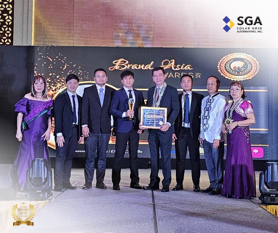 Team members of SGA Solar Grid Alternatives, Inc. posing with the Top Quality Brand award, celebrating their achievement at the Brand Asia Awards 2024.